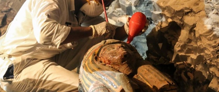 An archaeologist restores a sarcophagus in the recently discovered tomb of Amon's goldsmith Amenemhat near Luxor in southern Egypt. IBRAHIM RAMADAN / ANADOLU AGENCY